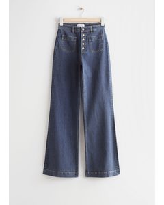 Jeans Met Knopen Met Uitlopende Pijp Middenblauw