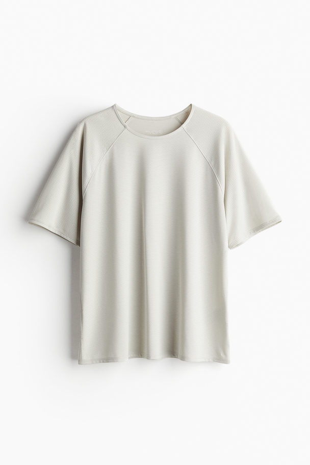 H&M DryMove™ Sport-T-Shirt aus Mesh Ecru