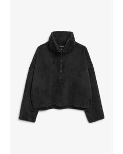 Schwarzer Faux-Fleece-Pullover mit kurzem Reißverschluss Dunkles Schwarz