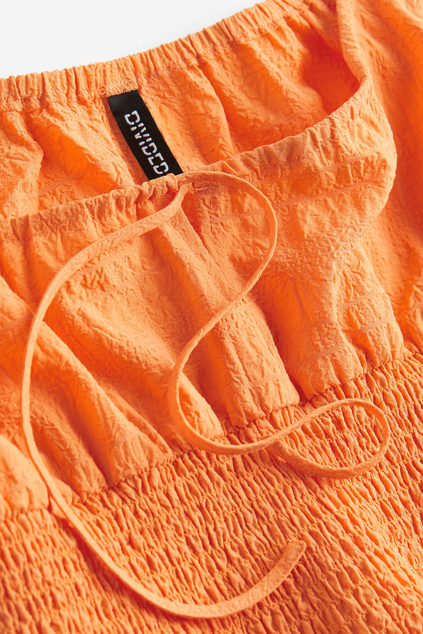 H&M Gesmokte Bluse mit Puffärmeln Orange