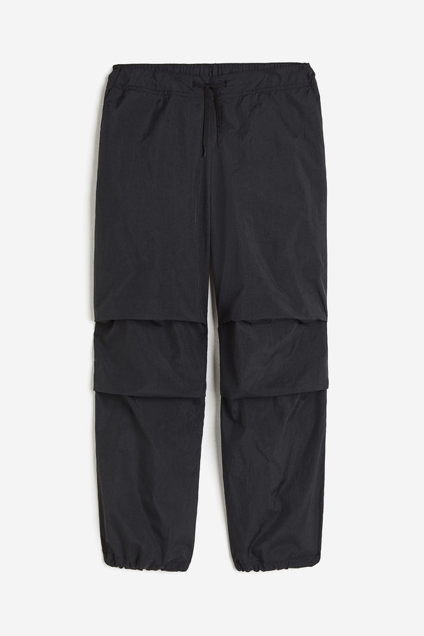 H&M Winddichte Fallschirmhose Schwarz