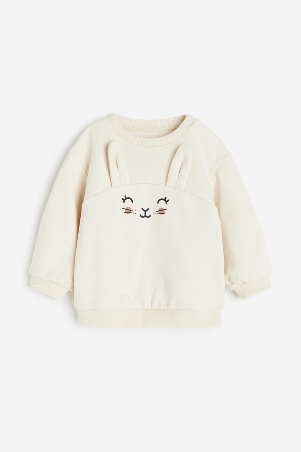 H&M Sweatshirt aus Baumwolle Hellbeige/Kaninchen