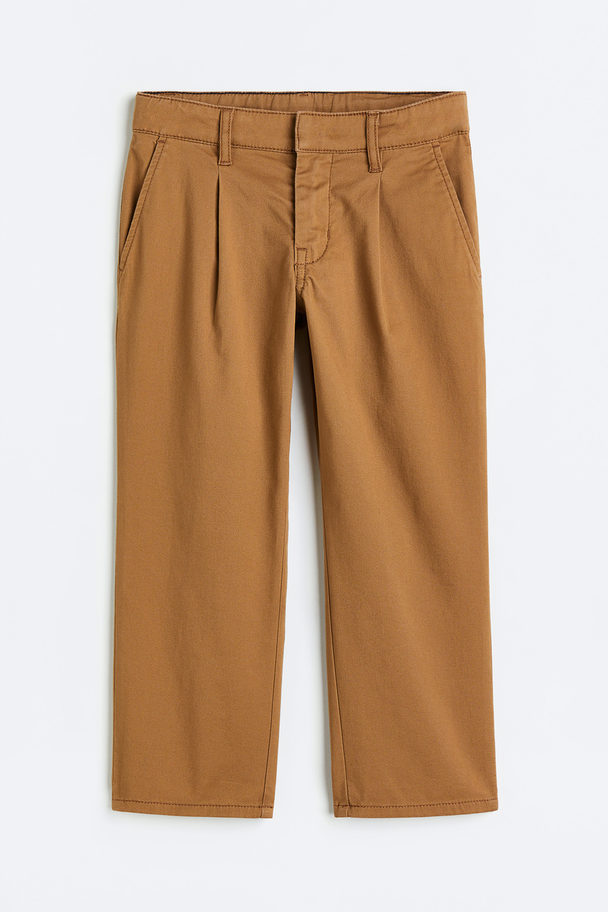 H&M Baumwollchino Relaxed Fit Dunkelbeige