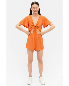 Oranger Jumpsuit zum Binden mit Cut-out Orange