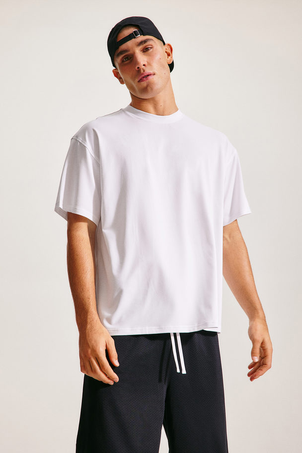 H&M DryMove™ Sportshirt in Loose Fit Weiß/Move 90