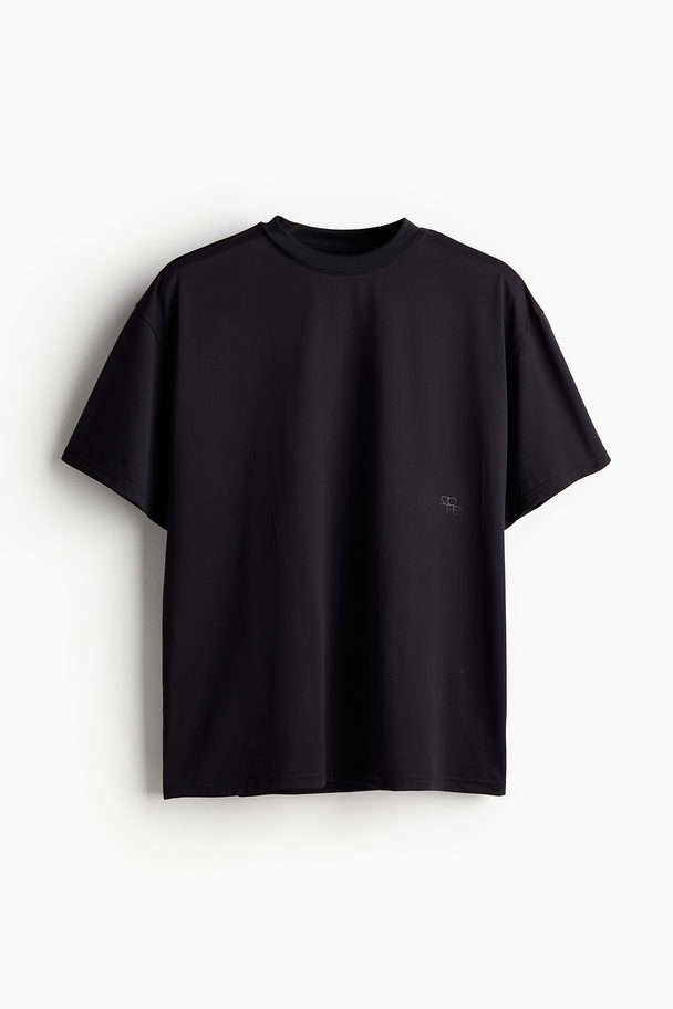 H&M DryMove™ Sportshirt in Loose Fit Schwarz