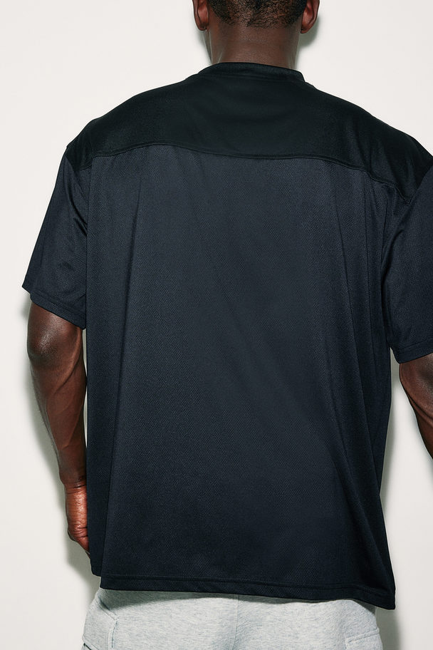 H&M DryMove™ Sportshirt in Loose Fit Schwarz