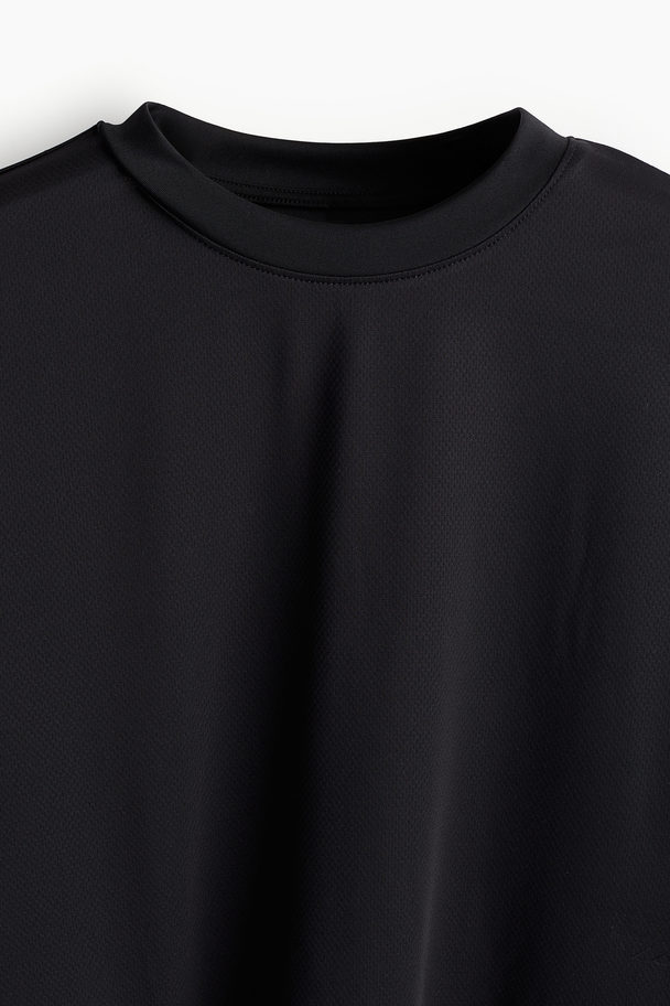 H&M DryMove™ Sportshirt in Loose Fit Schwarz