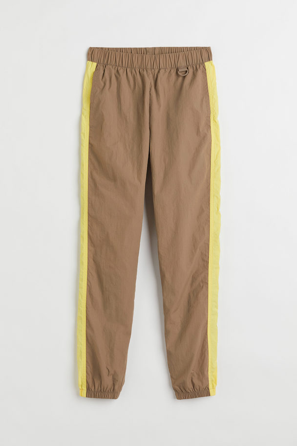 H&M Windproof Sports Trousers Dark Beige/yellow