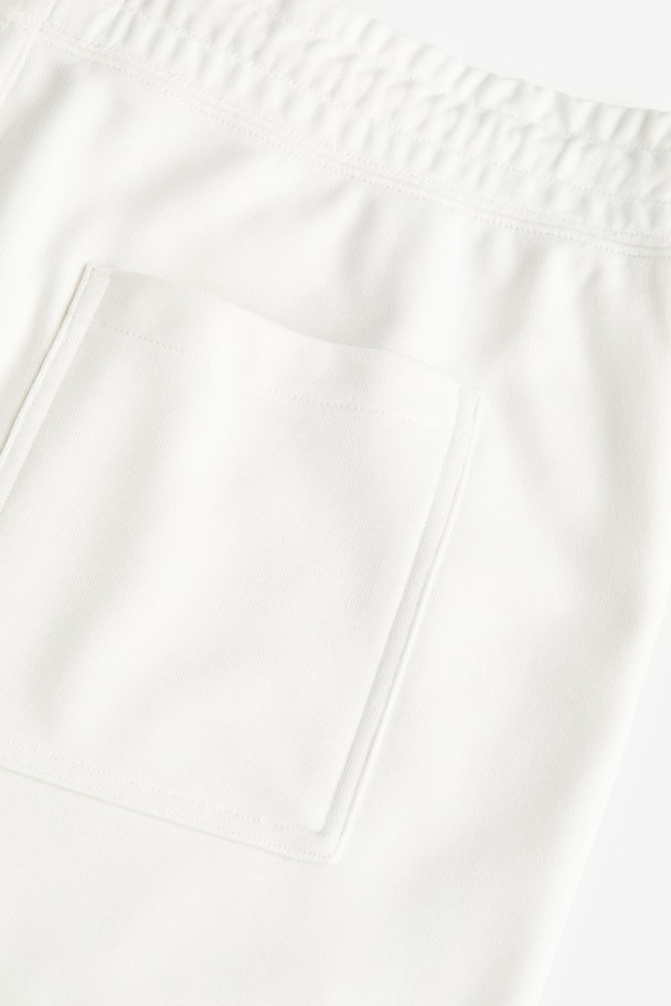 H&M Coolmax® Relaxed Fit Sweatshorts White/trust The Process