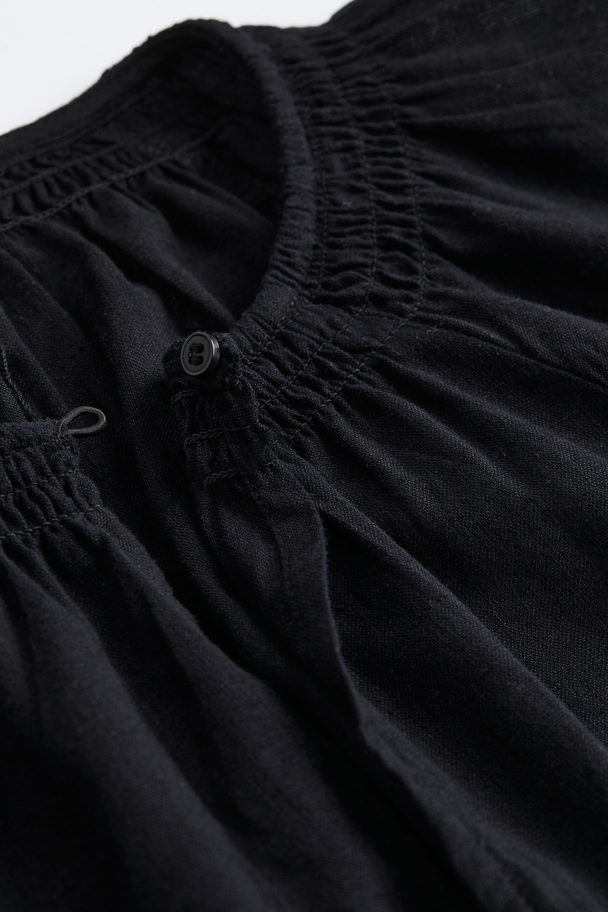 H&M Bestickte Bluse aus Leinenmix Schwarz/Weiß