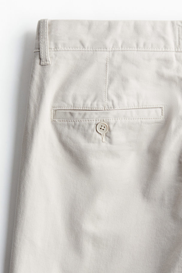 H&M Cropped-Chino aus Baumwolle in Regular Fit Hellbeige