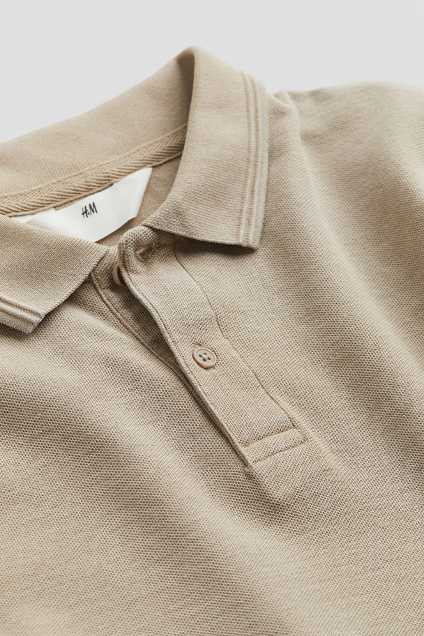 H&M Langarm-Poloshirt aus Baumwollpikee Beige