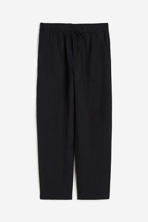 H&M Schmal zulaufende Hose aus Leinenmix Schwarz