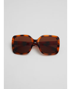 Sonnenbrille mit quadratischem Rahmen Braun/Orange gemustert