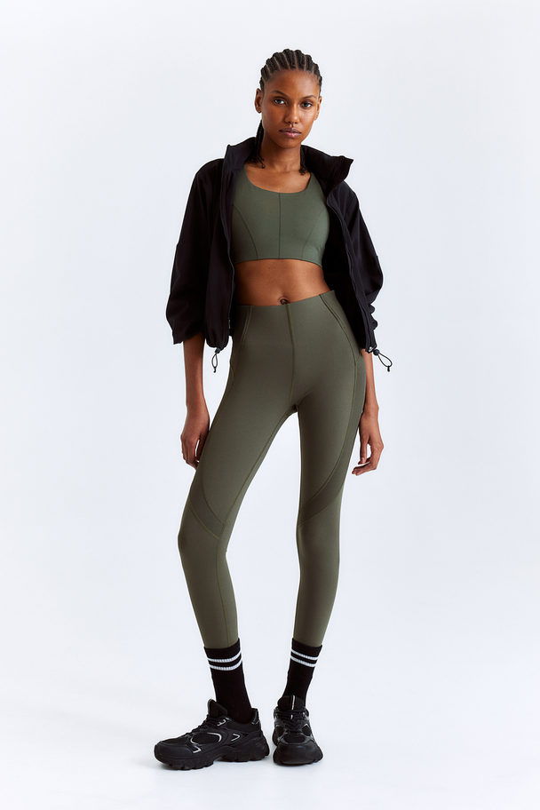 H&M DryMove™ Sportleggings Khakigrün