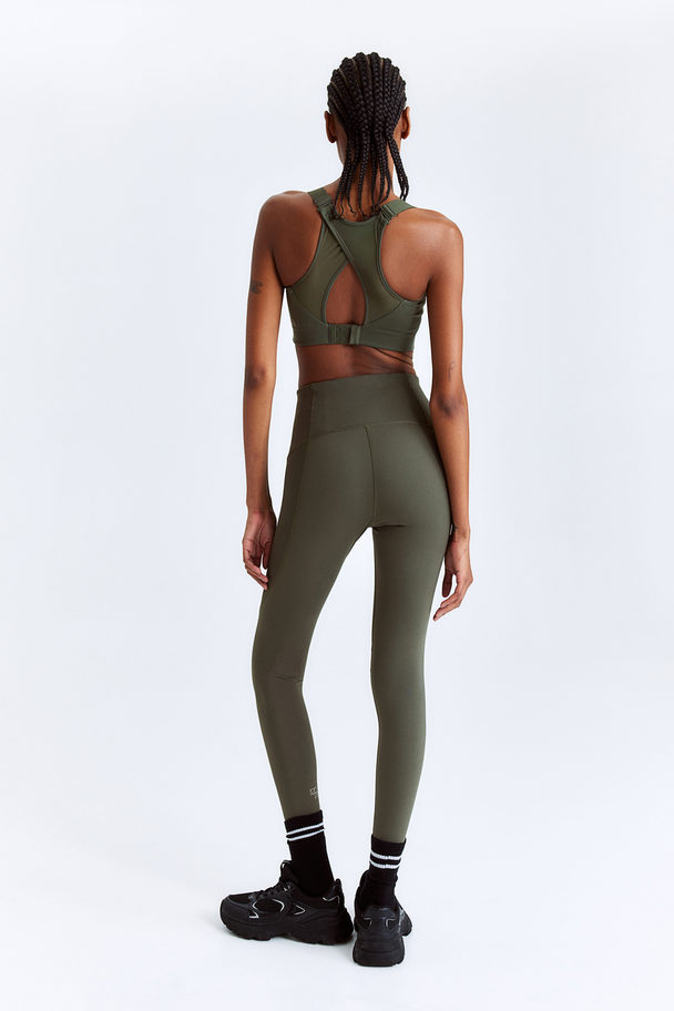 H&M DryMove™ Sportleggings Khakigrün