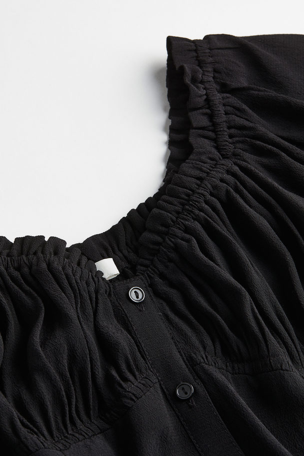 H&M Schulterfreies Kleid aus Crêpe Schwarz