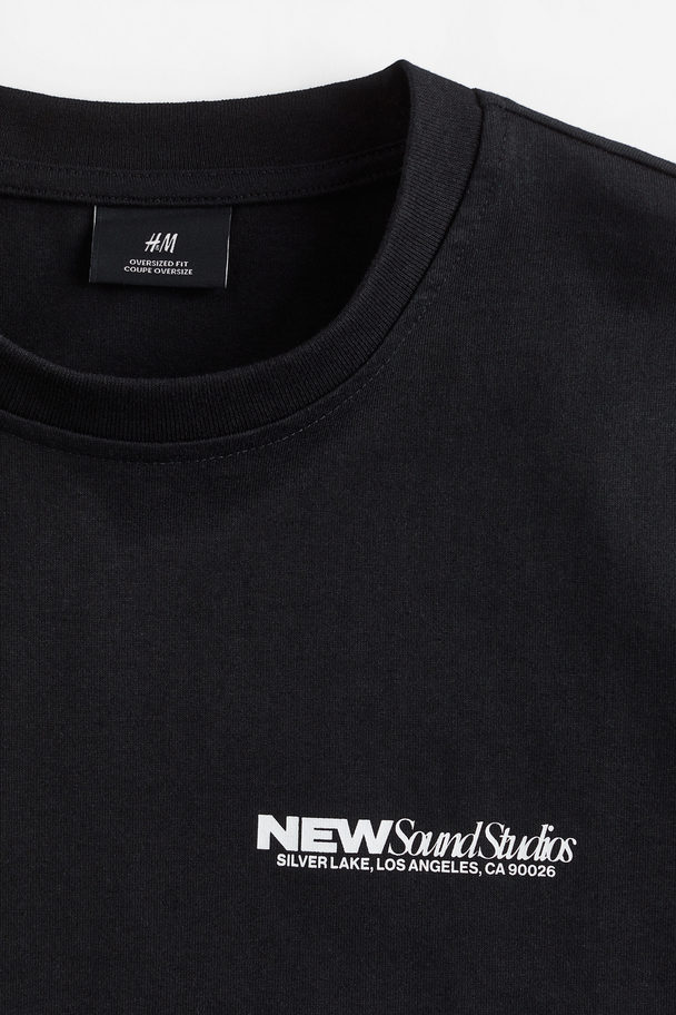 H&M Bedrucktes T-Shirt in Oversized Fit Schwarz/New Sound