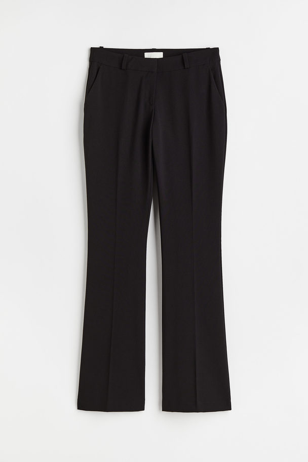 H&M Ausgestellte Hose mit Bügelfalten Schwarz