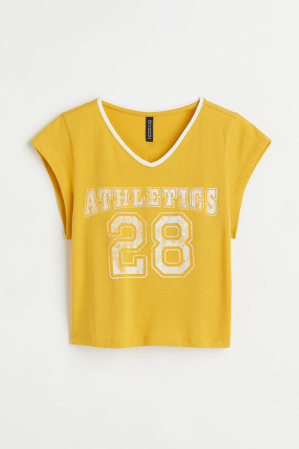 H&M Kurzes Shirt mit Print Gelb/Athletics