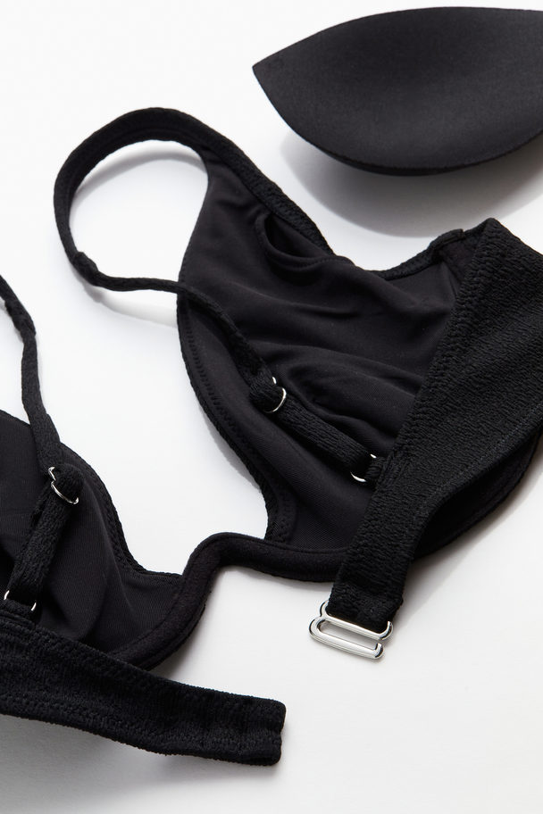 H&M Wattiertes Bikinitop mit tiefem Ausschnitt Schwarz
