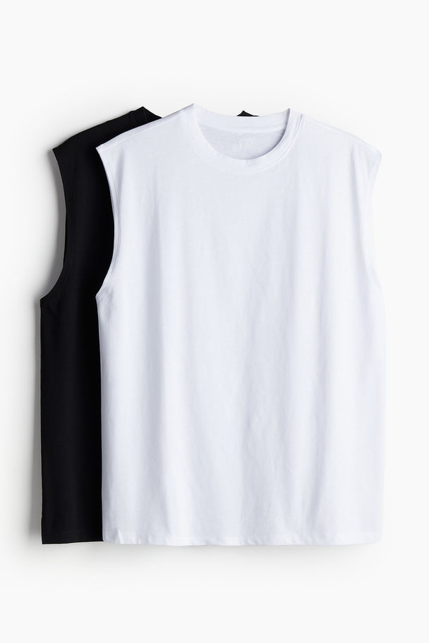 H&M 2er-Pack DryMove™ Sport-Tanktops Schwarz/Weiß