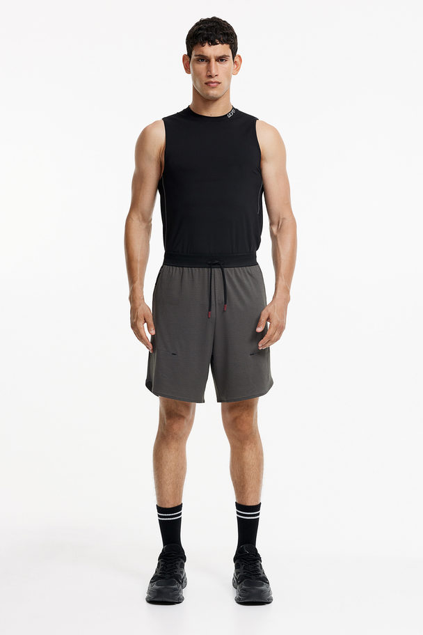 H&M Drymove™ Stretch Sports Shorts With Zipped Pockets Dark Grey/block-coloured