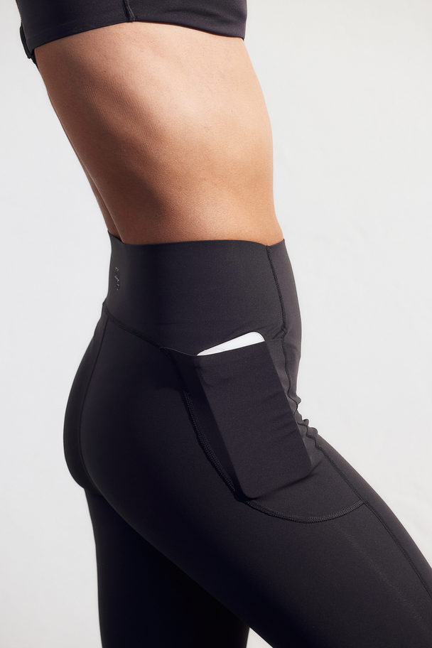 H&M DryMove™ Sportleggings mit Taschendetails Stahlblau