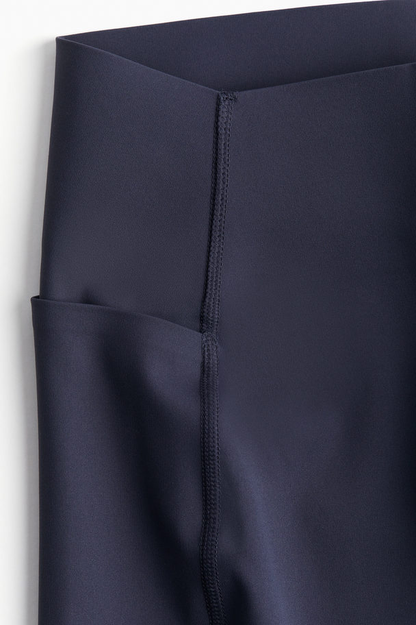 H&M DryMove™ Sportleggings mit Taschendetails Stahlblau