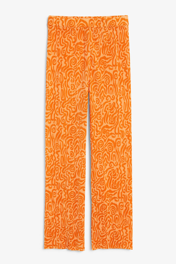 Monki Plissierte orangefarbene Hose mit ungesäumten Beinabschlüssen Orangefarbenes Wirbelmuster