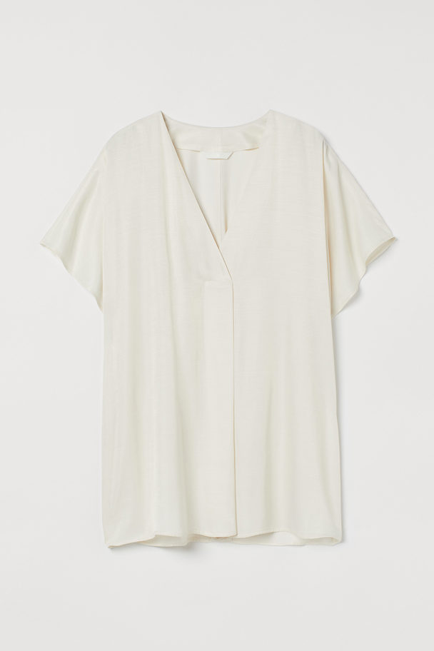 H&M Bluse mit V-Ausschnitt Cremefarben
