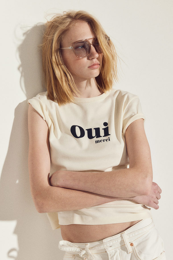 H&M Figurnahes Baumwoll-T-Shirt Cremefarben/Oui