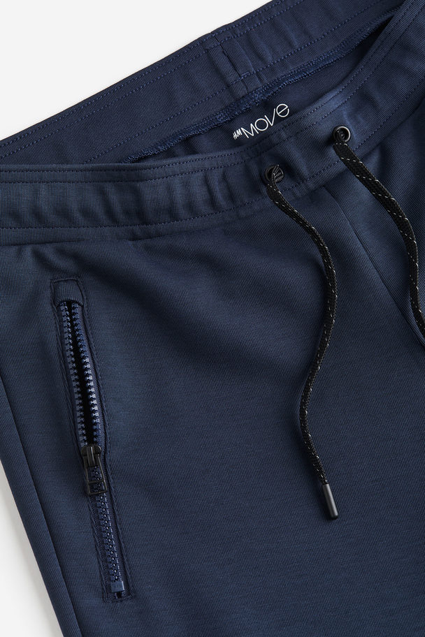 H&M Drymove™ Tapered Tech Joggers With Zipped Pockets Navy Blue