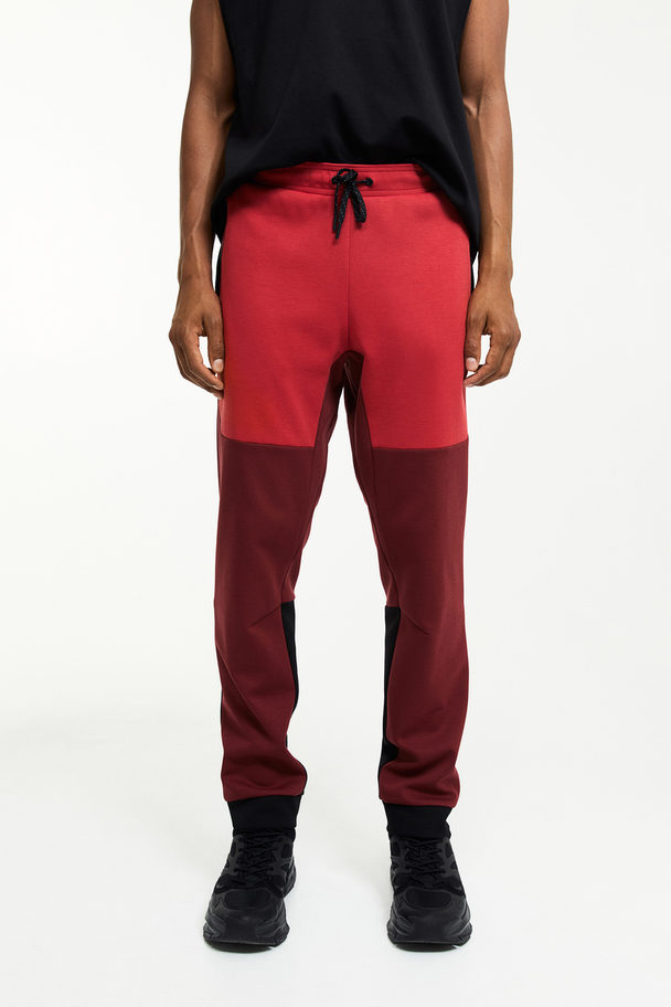 H&M Drymove™ Tapered Tech Joggers With Zipped Pockets Dark Red/block-coloured