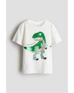 T-Shirt mit Wendepailletten Weiß/Tyrannosaurus