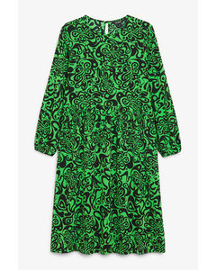 Grünes Kleid mit Retro-Wirbelmuster Grüne Retro-Blumen-Wirbel