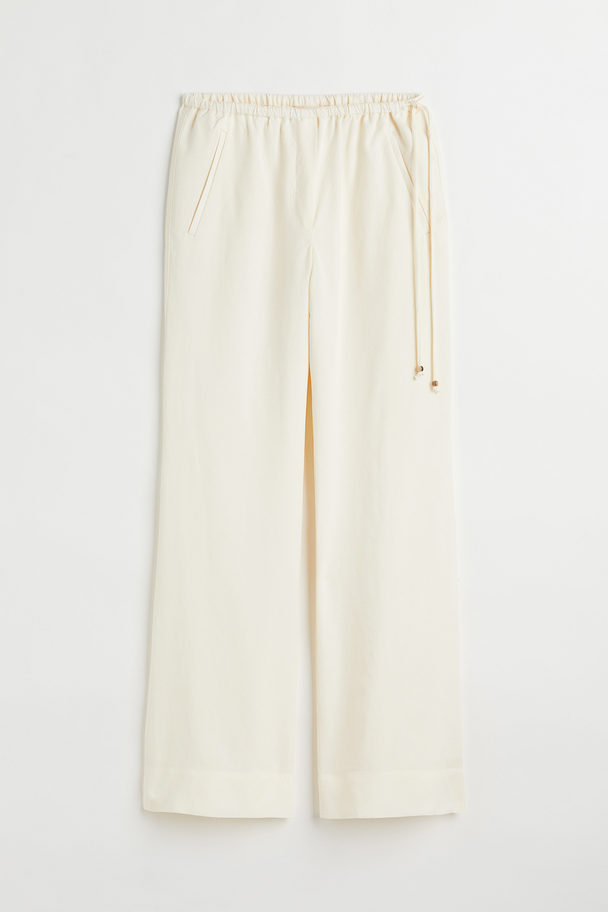 H&M Flared Lyocell-blend Trousers Cream