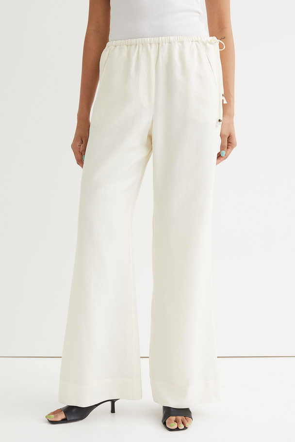 H&M Flared Lyocell-blend Trousers Cream