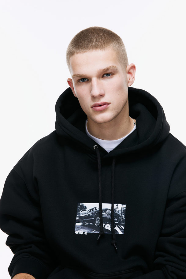 H&M Oversized Hoodie mit Motiv Schwarz/Auto