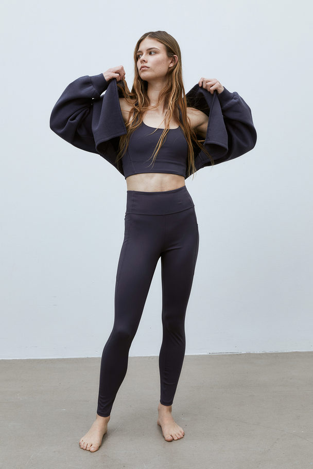 H&M DryMove™ Sportleggings mit Taschendetail Stahlblau