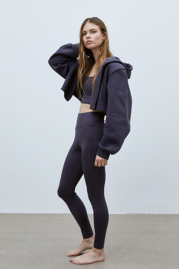 H&M DryMove™ Sportleggings mit Taschendetail Stahlblau