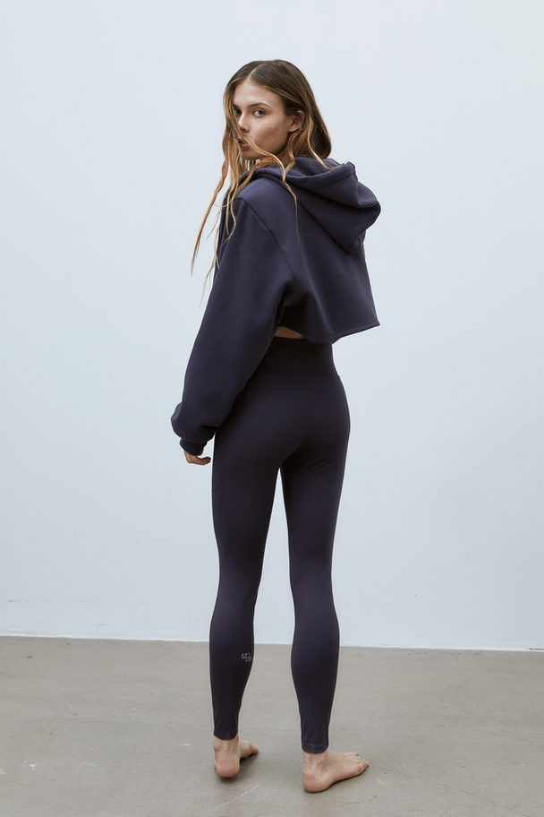 H&M DryMove™ Sportleggings mit Taschendetail Stahlblau