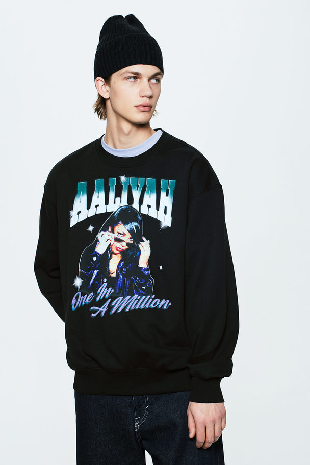H&M Sweatshirt in Loose Fit Schwarz/Aaliyah
