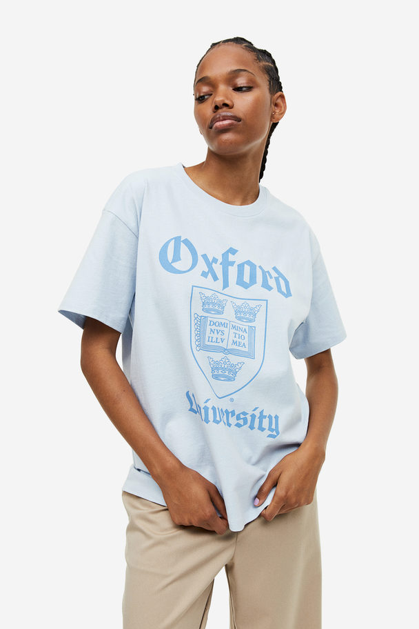 H&M Oversized T-shirt Met Print Lichtblauw/oxford University