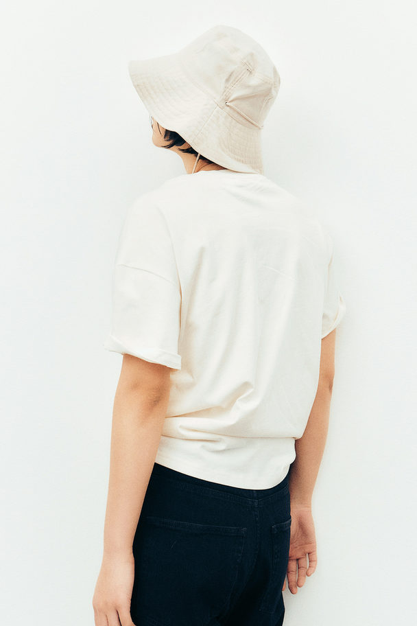 H&M Bucket Hat mit Kinnbändern Hellbeige