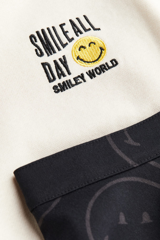 H&M 2-teiliges Set aus Sweatshirt und Rock Hellbeige/SmileyWorld®