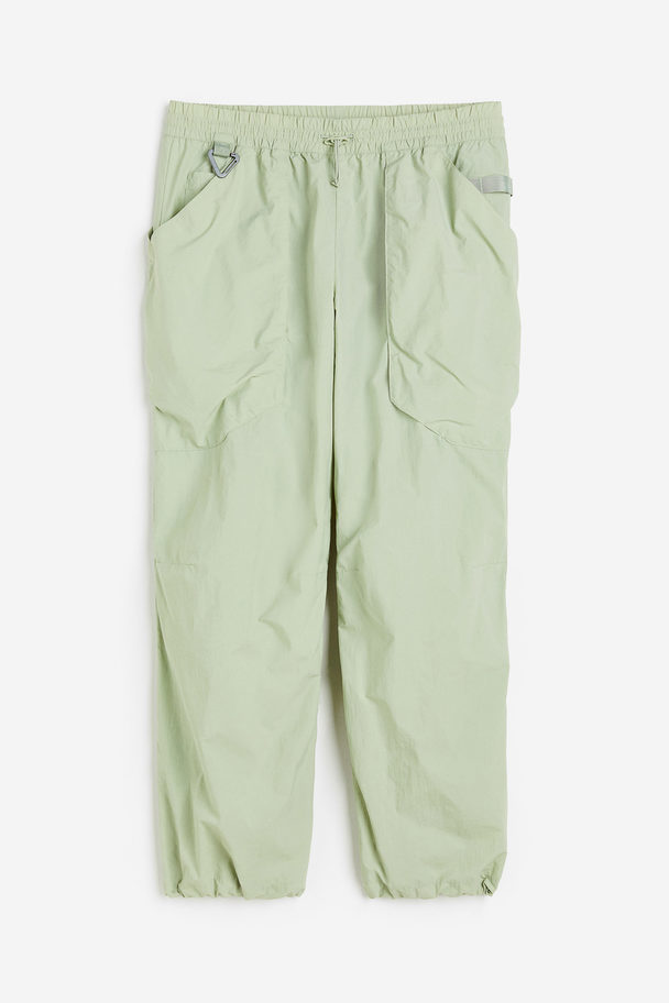 H&M Sport-Joggpants aus wasserabweisendem Nylon Pistaziengrün
