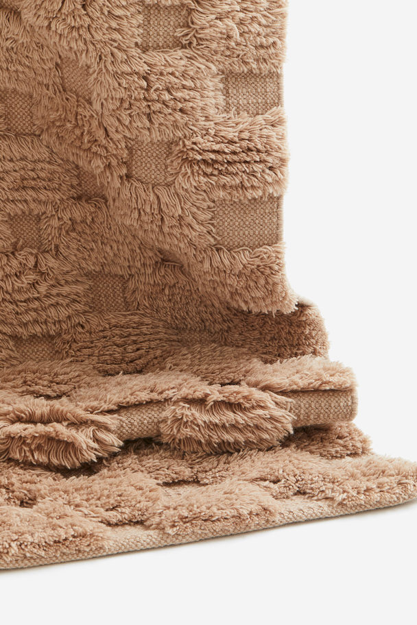 H&M HOME Getufteter Teppich aus Wollmix Beige