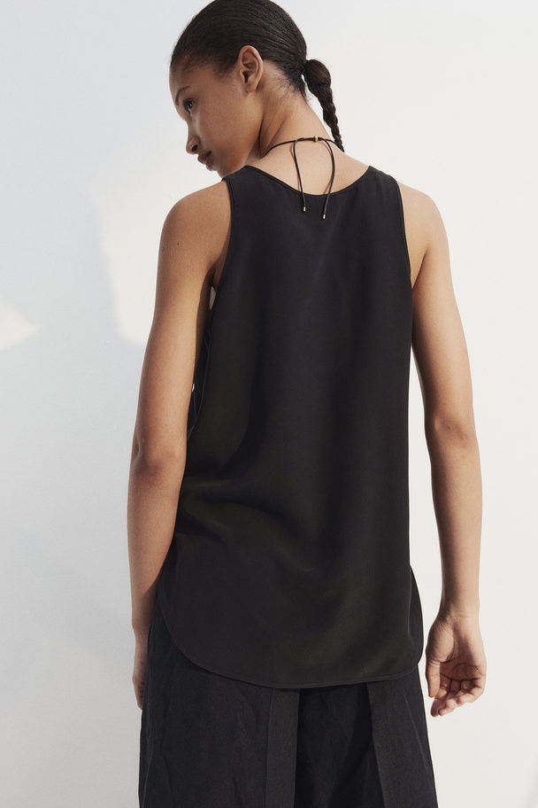 H&M Top aus Seiden-Crêpe Schwarz